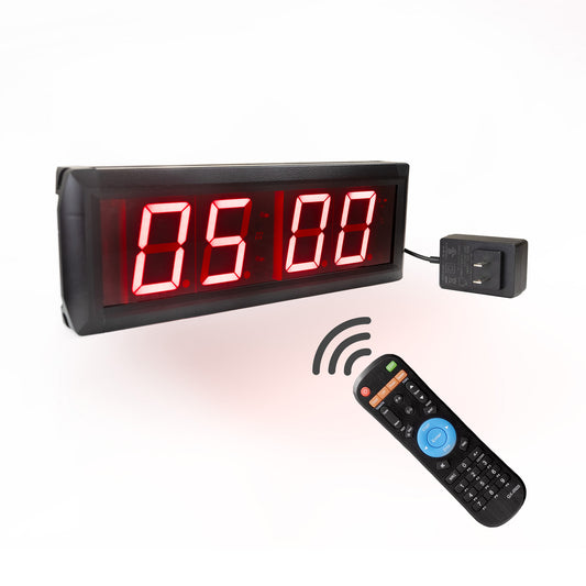 Digital timer with red illuminated 2 inch LED display, remote control, and power adapter on a white background.