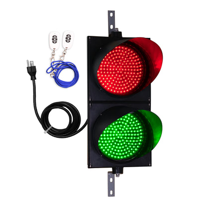 Traffic light with red and green lights, cable, and keychain on a white background