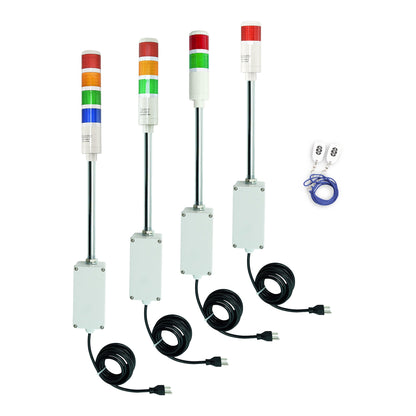 Collection of multicolor industrial signal lights with wiring on a white background.