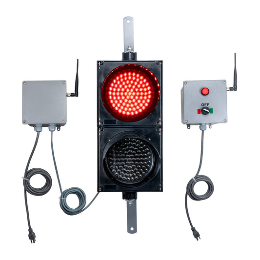 Front perspective of a wireless traffic light system with red LED light on and accompanying control box transmitter with mirrored pilot light and 2-position switch ton a white background.