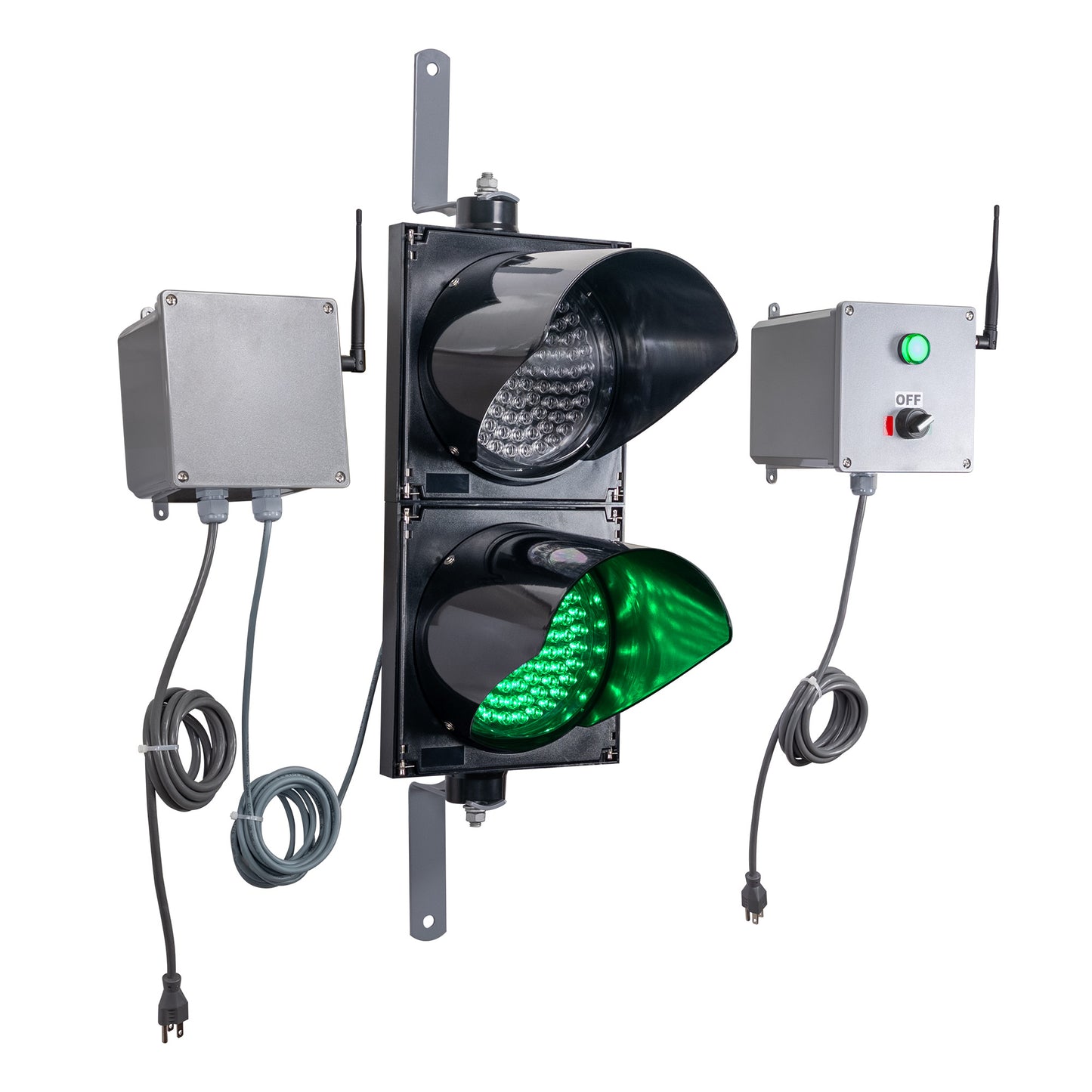 Angled perspective of a wireless traffic light system with green LED light on and accompanying control box transmitter with mirrored pilot light and 2-position switch ton a white background.