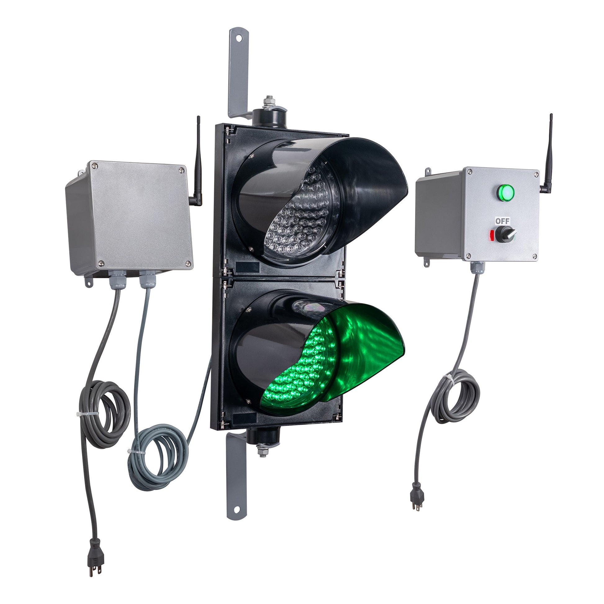 Angled perspective of a wireless traffic light system with green LED light on and accompanying control box transmitter with mirrored pilot light and 2-position switch ton a white background.