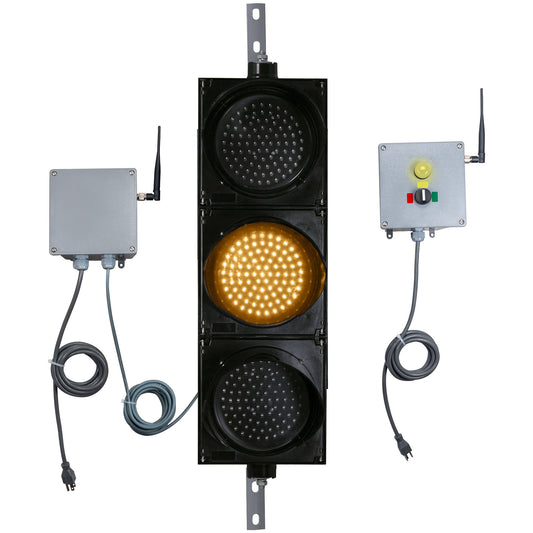 Front perspective of a wireless traffic light system with amber LED light on and accompanying control box transmitter with mirrored pilot light and 3-position switch ton a white background.