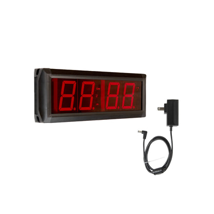 Digital counter/timer with red LED display and power adapter on a white background