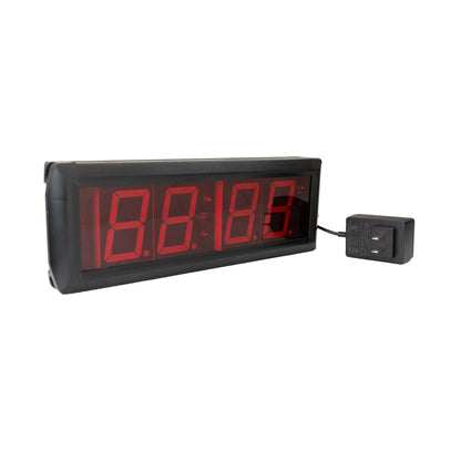 Digital clock with red LED display on a white background