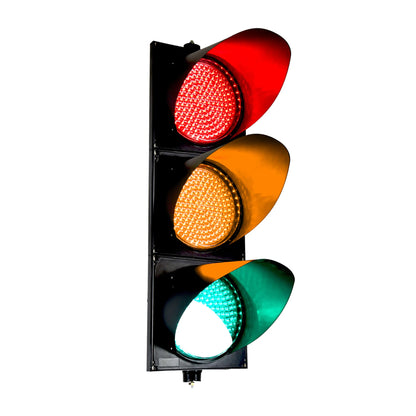 Traffic light with red, yellow, and green lights on a white background