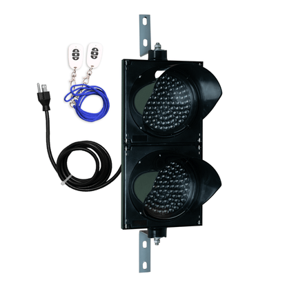 Black wireless 8 inch traffic light with white wireless key fob on a white background.